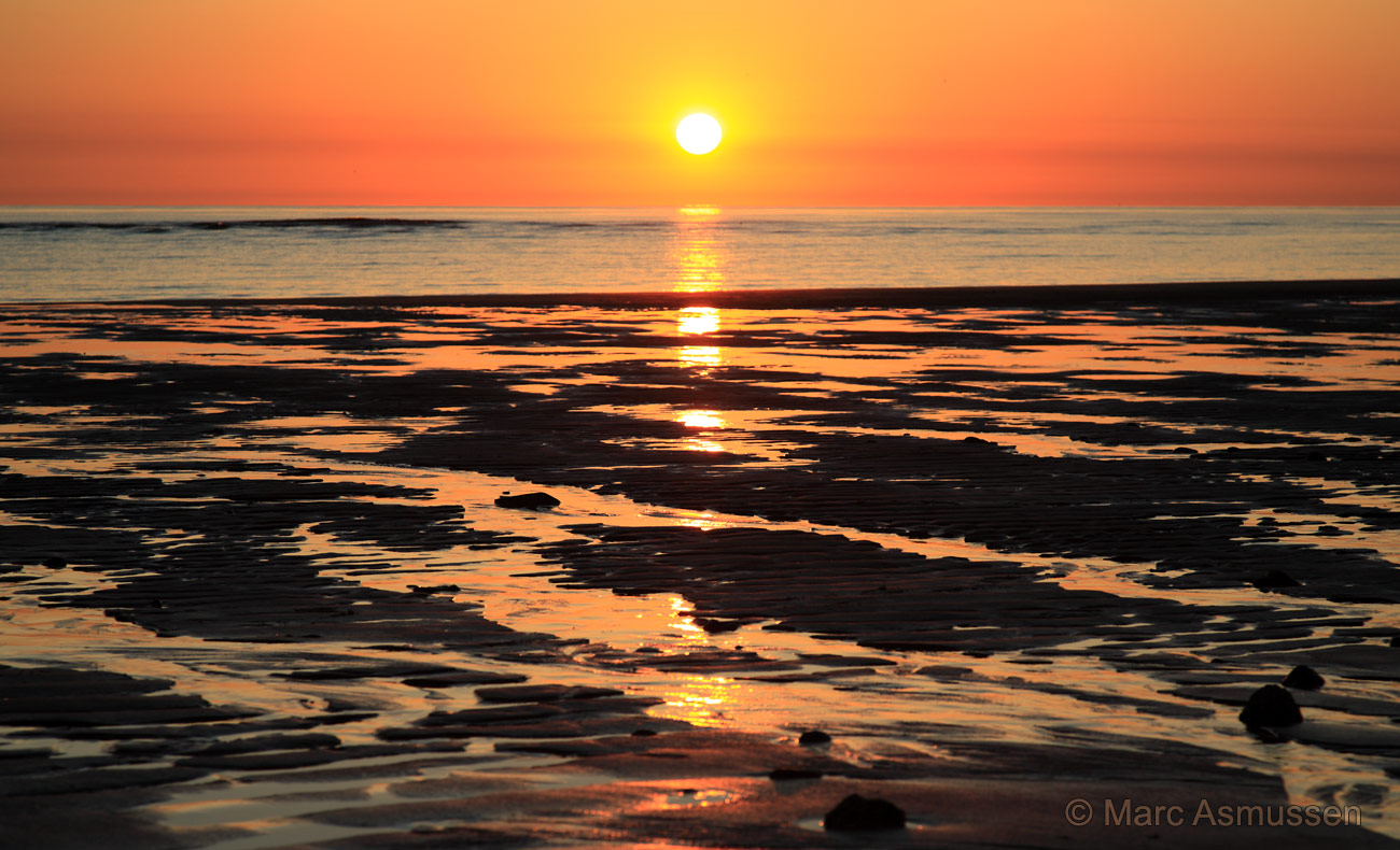 Sonnenuntergang mit Wasserriffeln